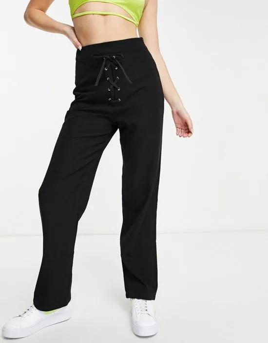 eyelet lace up front wide leg pants in black