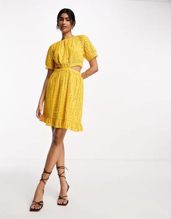 eyelet mini dress with cut out sides in yellow