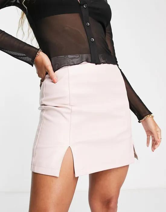 faux leather mini skirt with side slit in blush