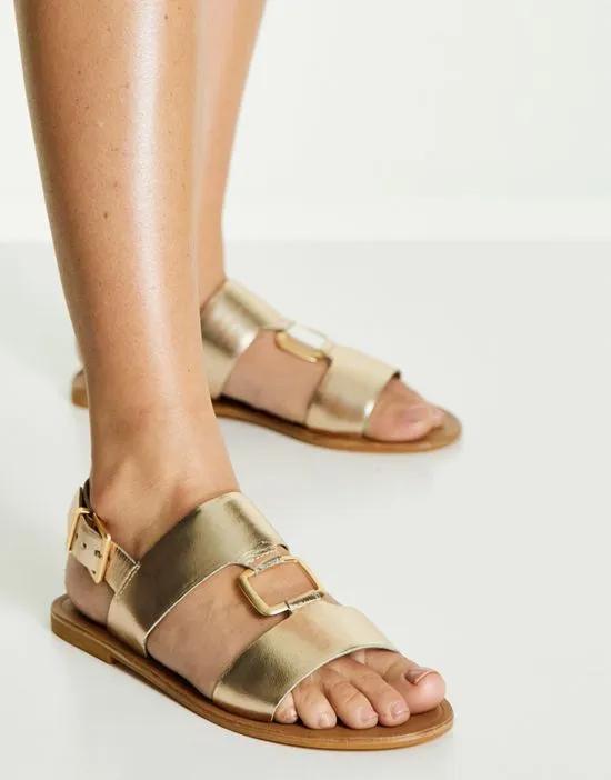 Fenix leather ring detail flat sandals in gold