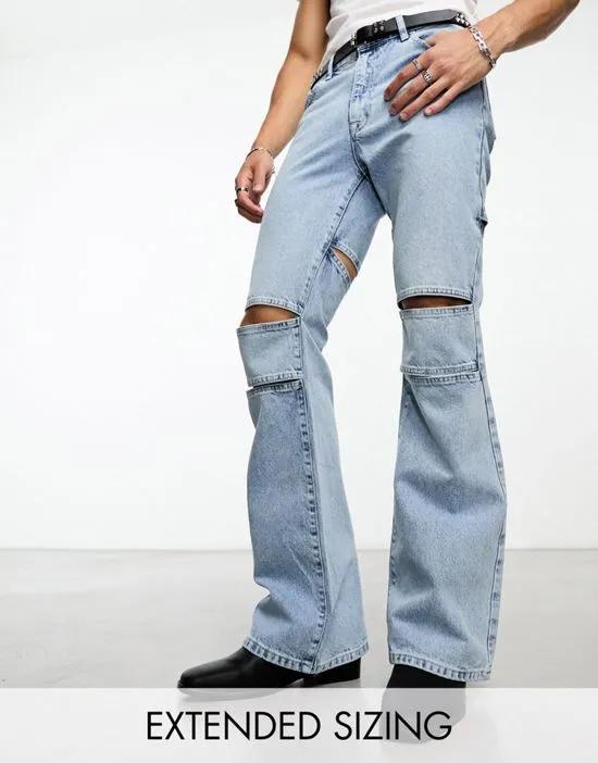 flare jeans with rips in light wash blue