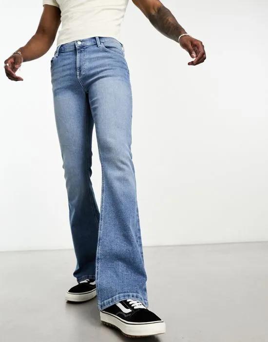 flared jeans in mid wash blue