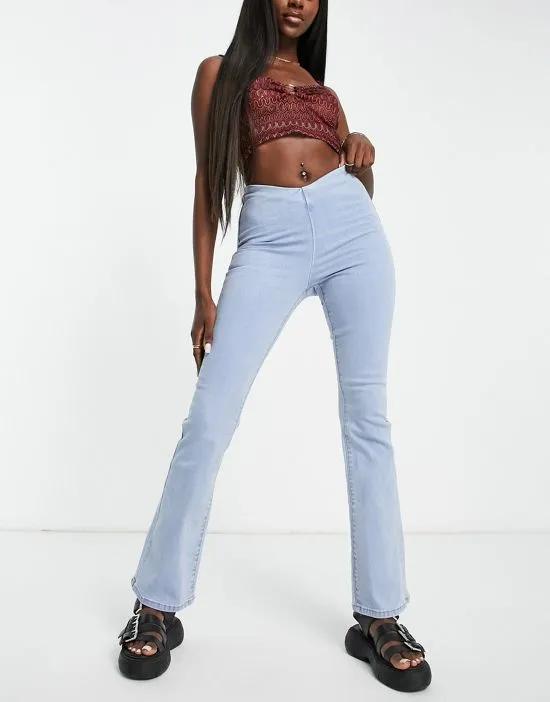 flared jeans with zip fastening in light blue wash