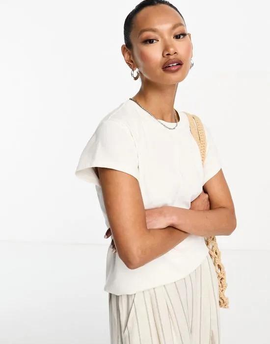 flared short sleeve top with seam detail in white