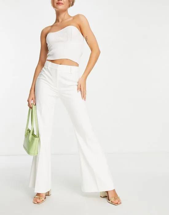 flared tailored pants in ivory