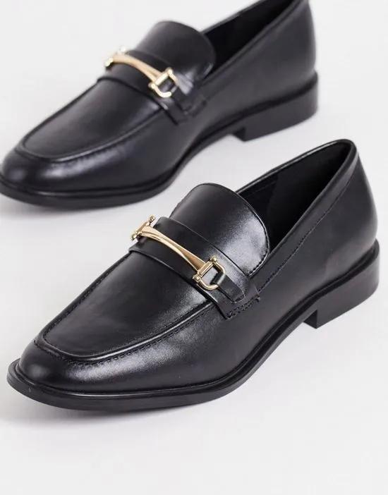 flat loafer shoes with gold buckle in black