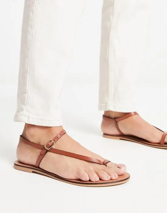 Flutter leather toe loop flat sandal in tan