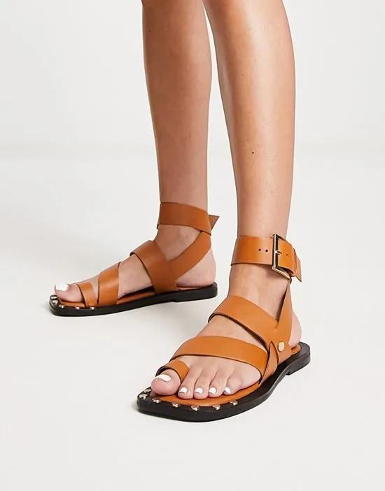 Foxy leather studded toe loop flat sandal in tan