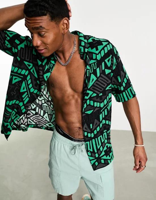 geometric print shirt in black and turquoise