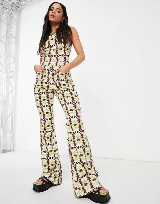halter neck jumpsuit with flare leg in geo print
