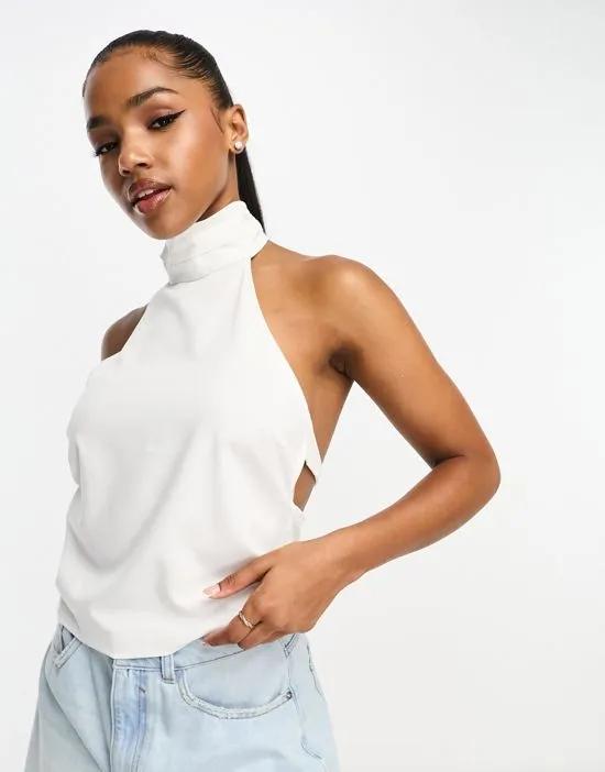 halterneck top with backless detail in white