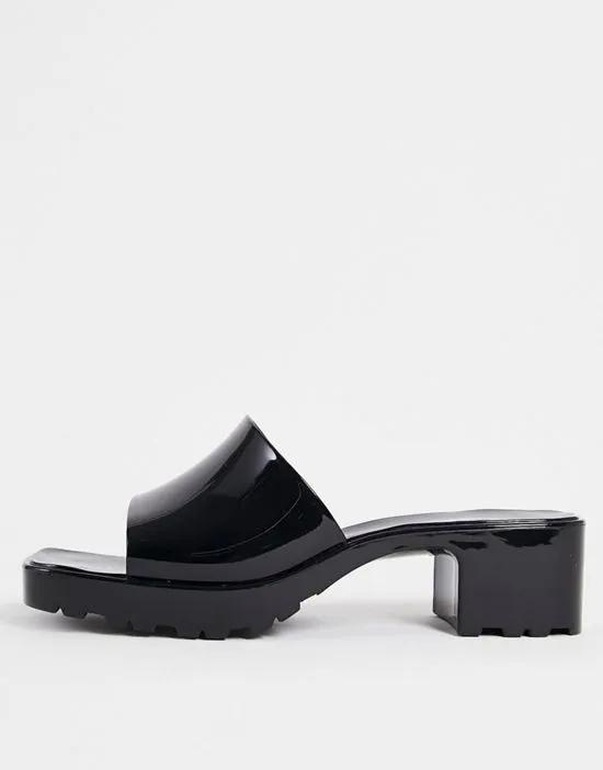 heeled jelly mules in black