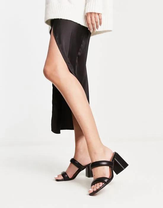 Height padded mid heeled mules in black