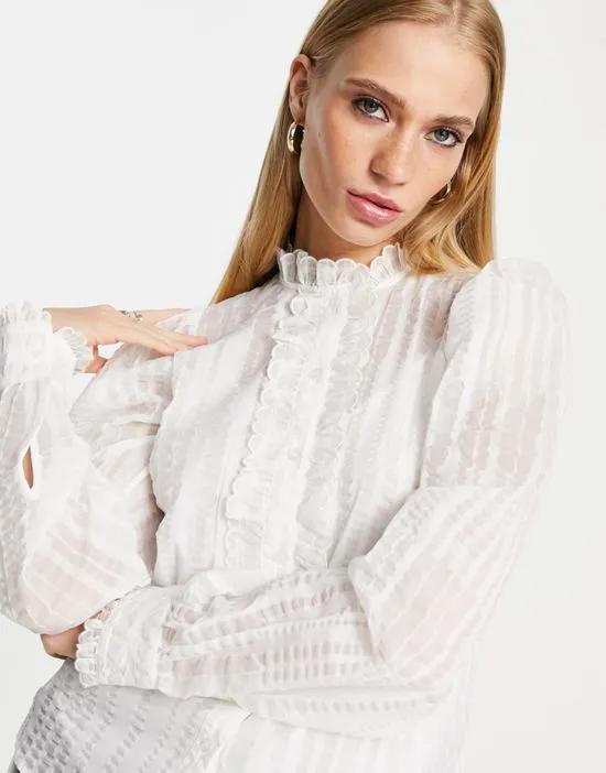 high neck frill blouse in off white