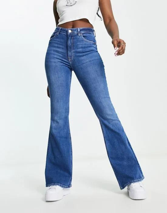 high rise flared jeans in mid blue