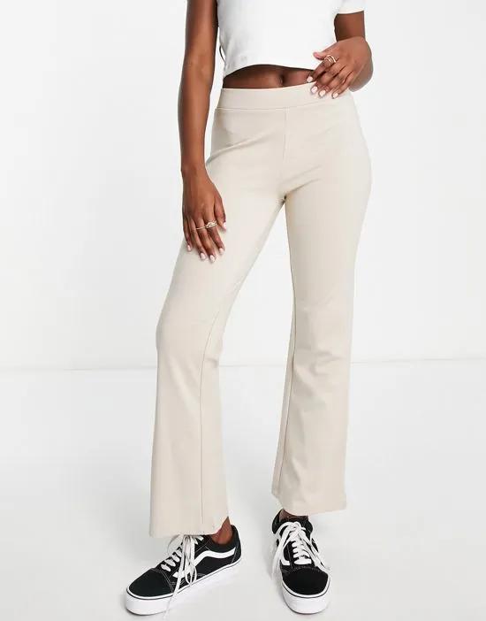 high rise flared pants in sand