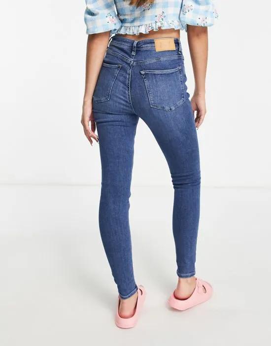 high rise skinny jean in mid blue wash