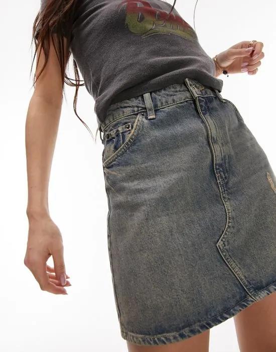 high waist denim skirt with pink tint