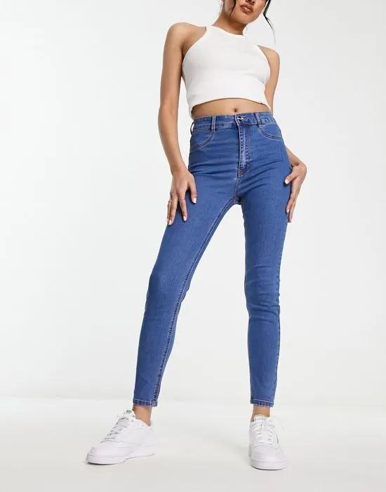 high waist skinny jeans in mid blue