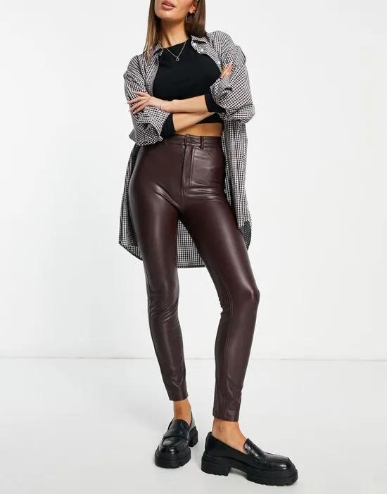 high waisted faux leather skinny pants in burgundy