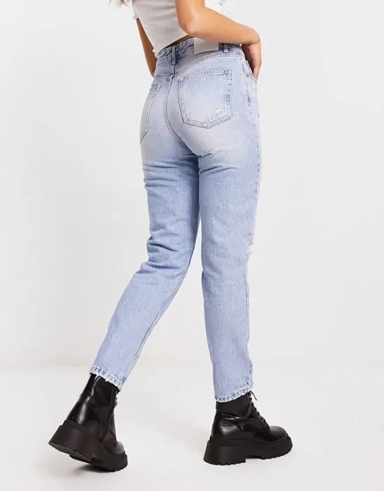 high waisted mom jean with rips in light blue