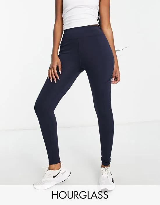 Hourglass icon leggings with booty-sculpting seam detail and pocket