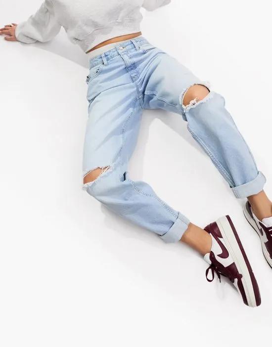 Hourglass relaxed mom jeans in light blue with knee rips