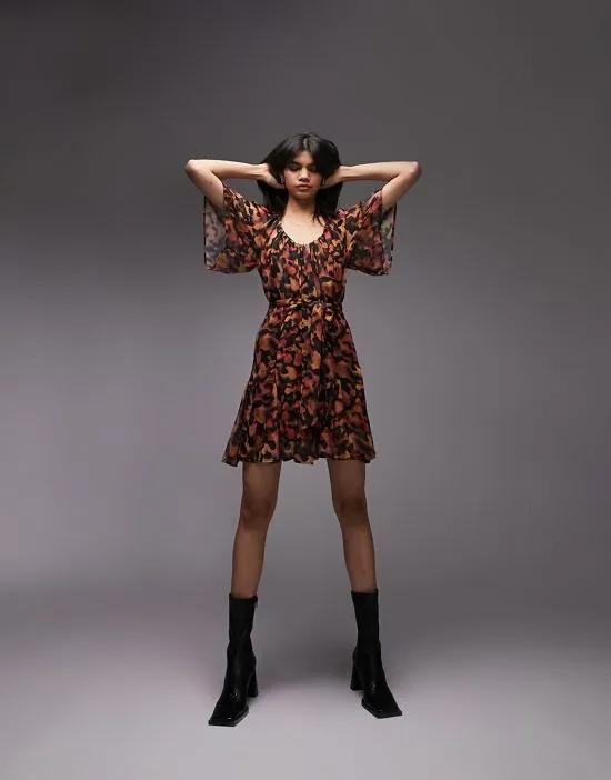 inky printed tie waist mini dress in orange