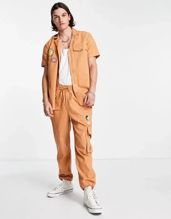 inspired cargo pants with badges in tan - part of a set