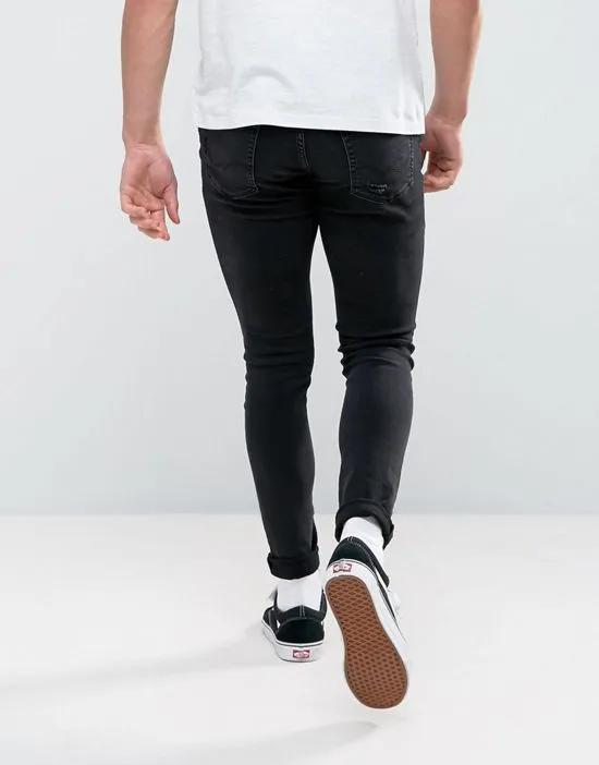 Intelligence Liam skinny fit ripped jeans in black wash