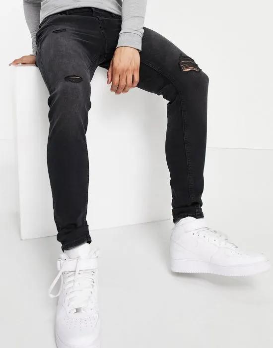 Intelligence Pete carrot fit jeans in washed black with rips