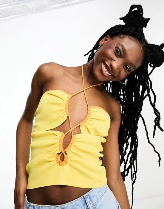 knit halter top with cut-out detail and contrast trim in yellow