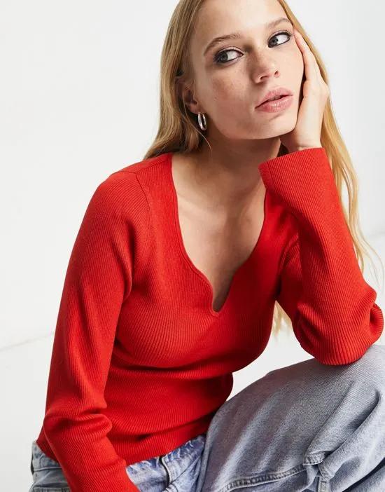 knit top with shaped neckline in red
