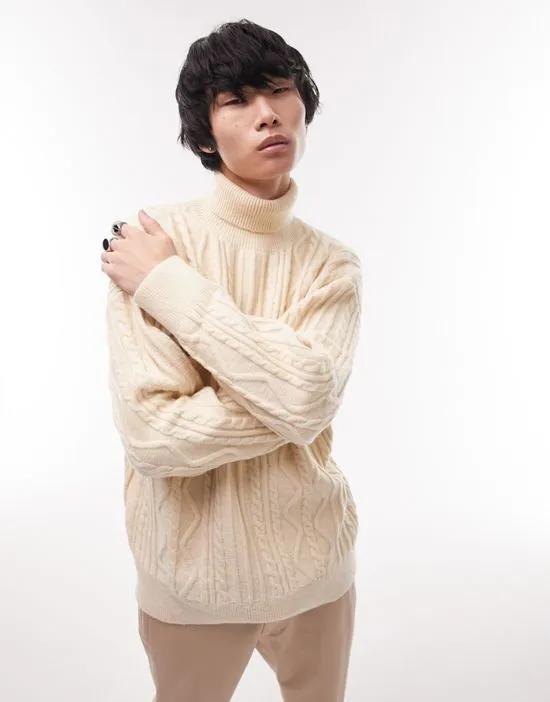 knitted cable heavyweight sweater with roll neck in stone