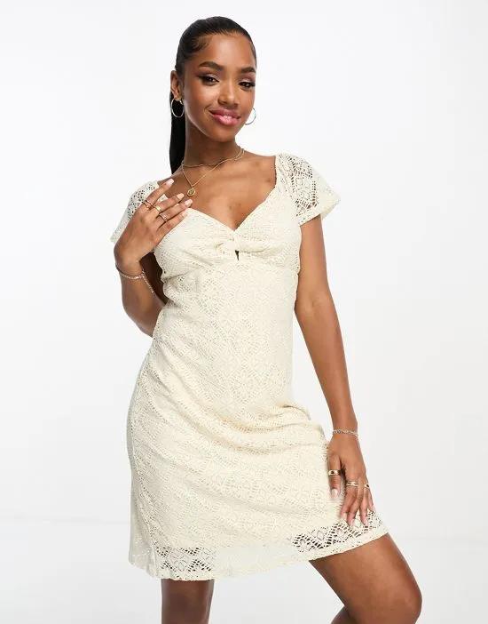 knot front lace mini dress in cream