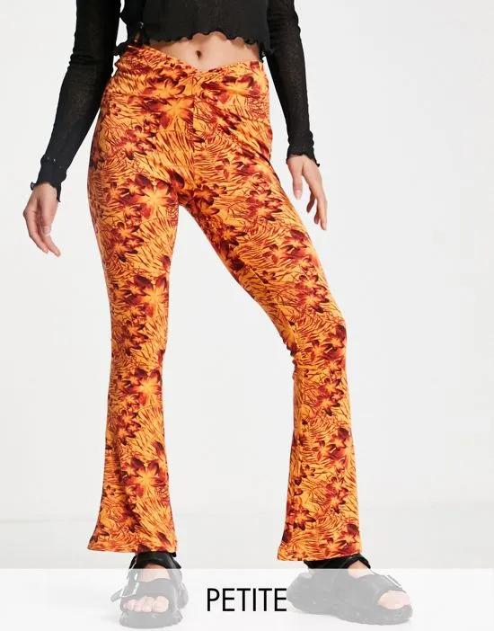 knot twist front flared pants in orange hibiscus print