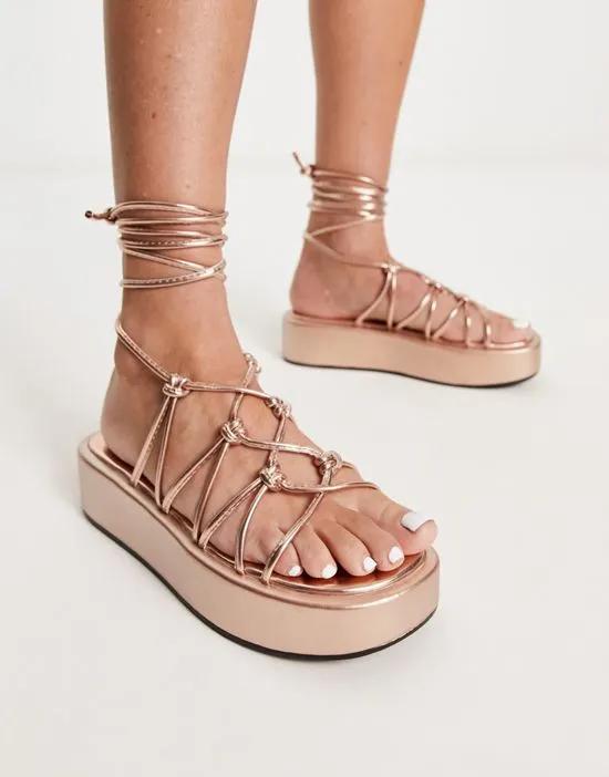 knotted strappy tie leg sandals in rose gold