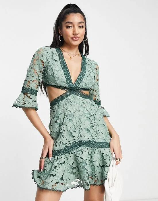 lace mini dress with circle trim and cut out detail in sage green
