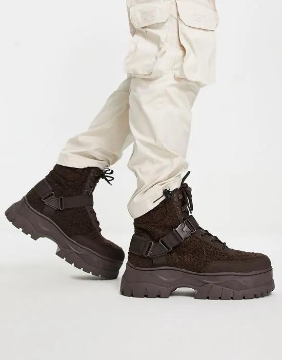 lace up boot in brown teddy with strap detail on chunky sole