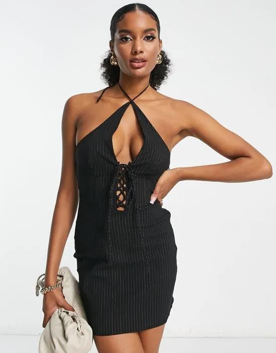 laced front halter mini dress in black pinstripe