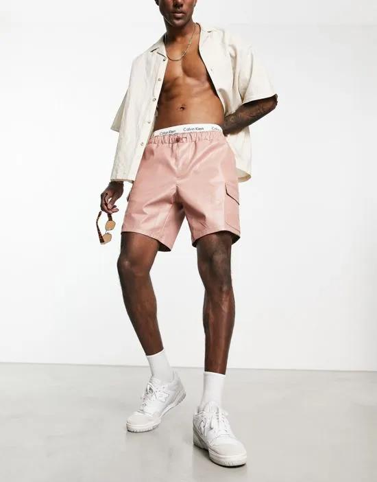 leather look cargo shorts in mid length in pink