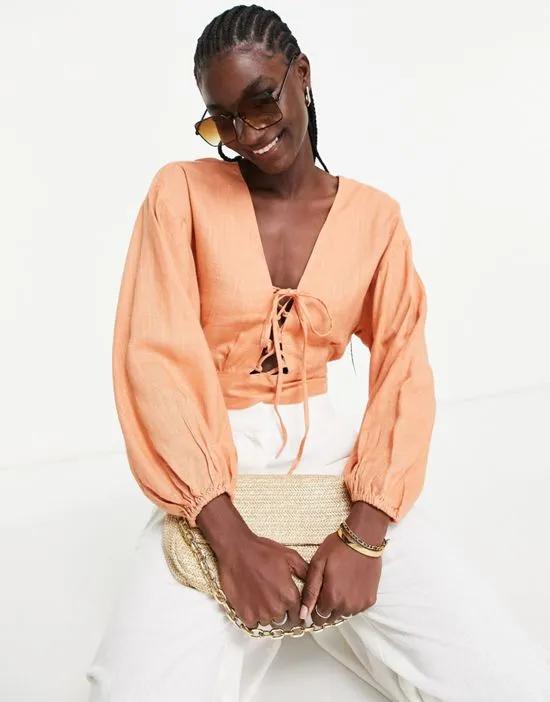 linen top with lace-up front & volume sleeves in peach