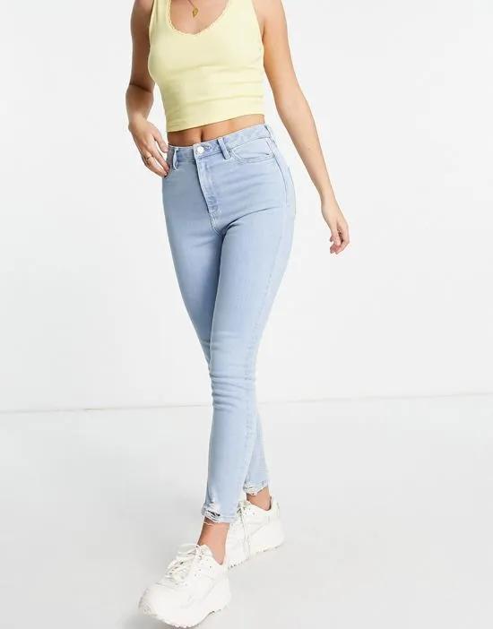 Lizzie skinny jeans with frayed hem in light wash blue