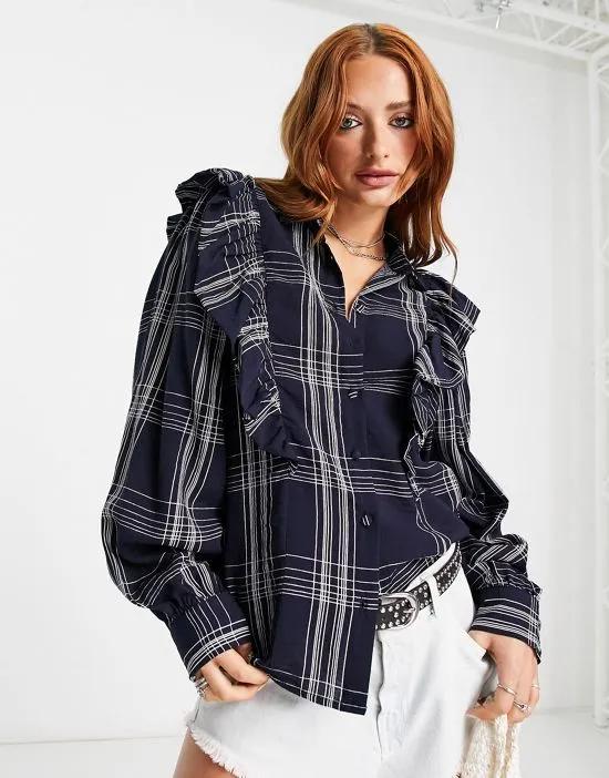 long sleeve button down shirt with shoulder ruffles in navy plaid