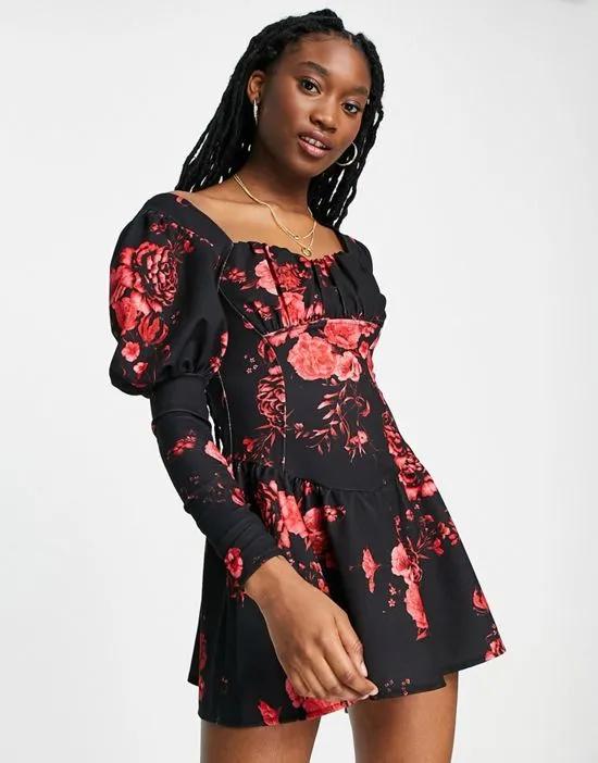 long sleeve flippy mini dress with ruched bust in red floral print