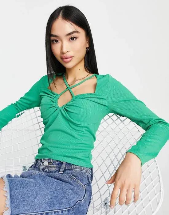 long sleeve keyhole cut out top in green