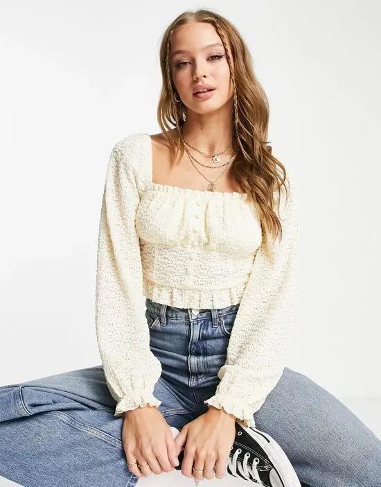 long sleeve lace button detail crop top in cream