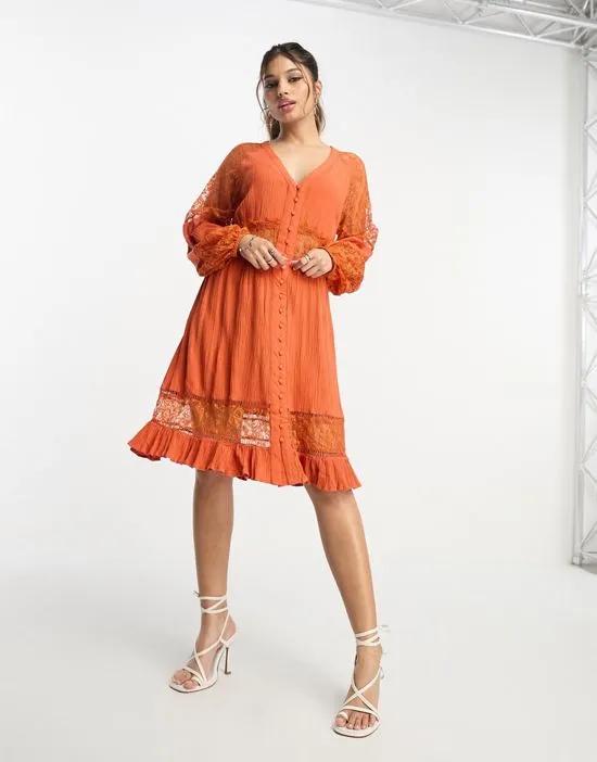 long sleeve mini dress with lace inserts in rust