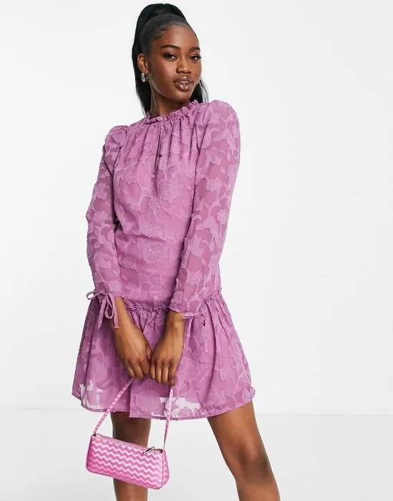long sleeve mini dress with ruffle skirt in lilac