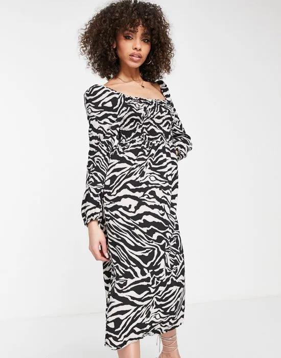 long sleeve ruched midi dress in zebra print